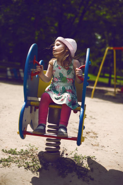 istock Little Girl at Playground 587888374