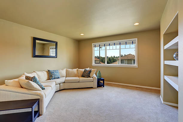 istock Cozy sitting room with large beige corner sofa set. 587890860