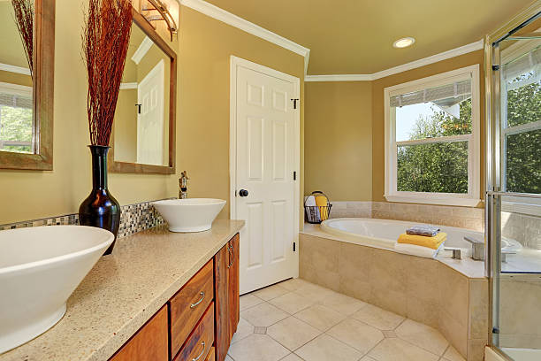istock Luxurious bathroom interior in warm beige color 587891284