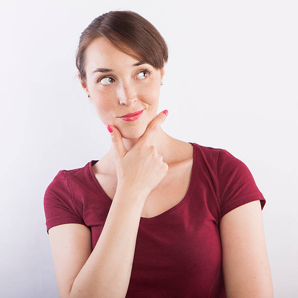 istock young beautiful woman  thinking, pensive face expression 587893064