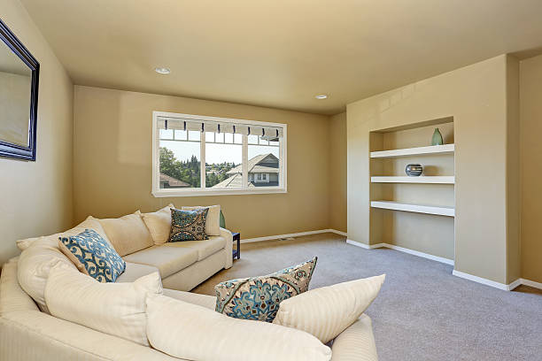 istock Cozy sitting room with large beige corner sofa set. 587893174