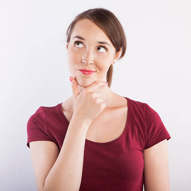 istock young beautiful woman  thinking, pensive face expression 587893272