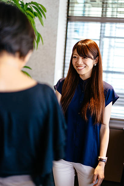 istock Japanese corporate representatives discussing about cooperation 587895334