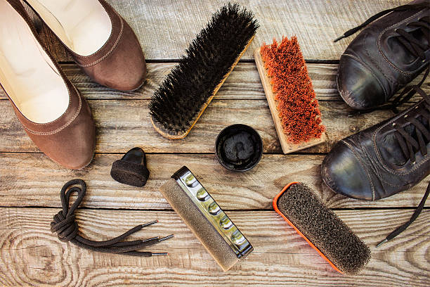 Women's shoes and care products for footwear Women's shoes and care products for footwear on wooden background. shoe polish photos stock pictures, royalty-free photos & images