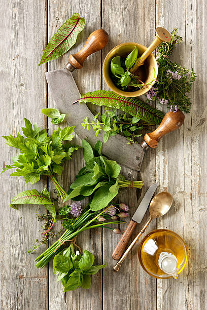 istock fresh herbs and spices on wooden table 587903878