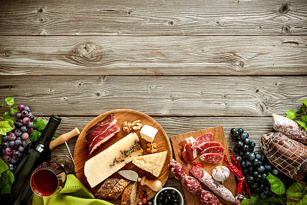 istock Romantic dinner with wine, cheese and traditional sausages 587904544