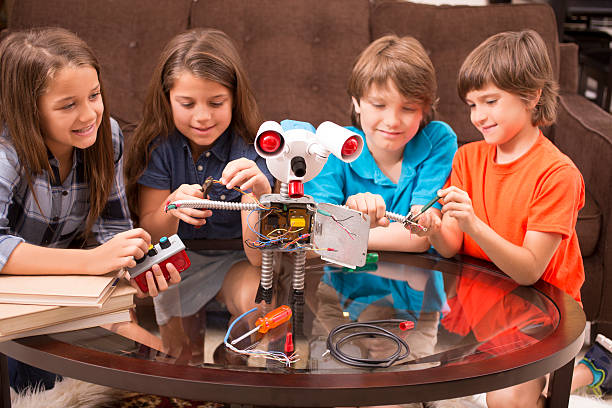 istock Children build robot together at home. 587911810