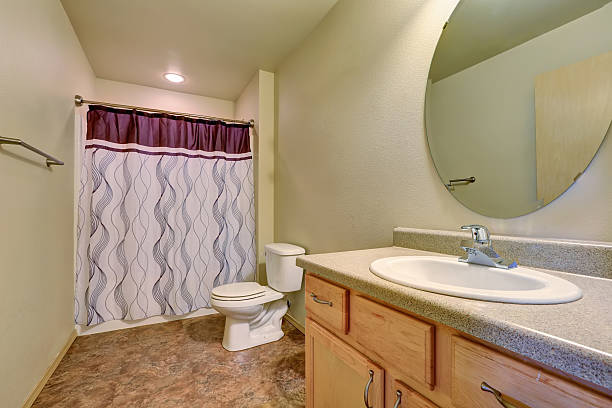 istock Bathroom interior with colorful shower curtain 587914252