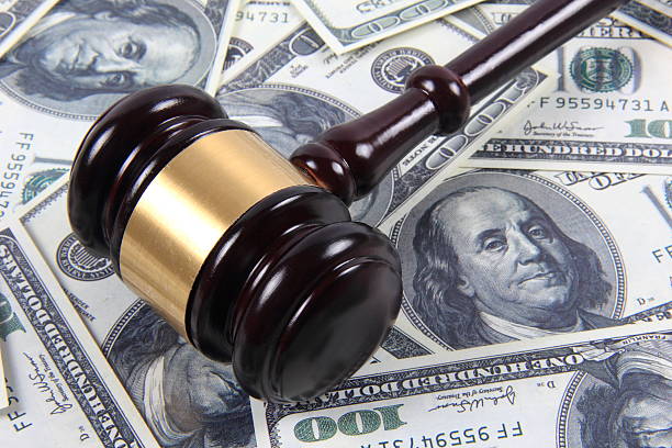 istock American money and gavel 587916280