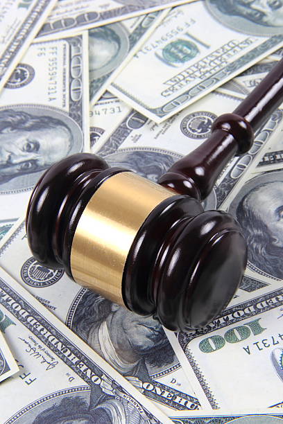 istock American money and gavel 587921722