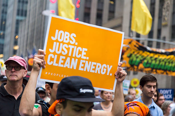 People carry placards during the People's Climate March, NYC stock photo