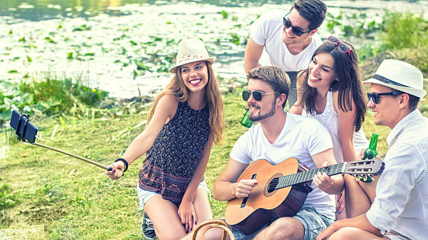istock Hipster Friends Taking Selfie 587924138