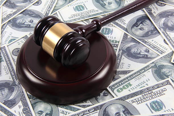 istock American money and gavel 587927728