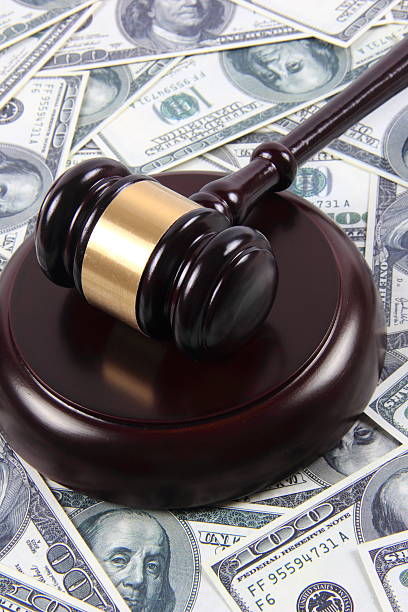 istock American money and gavel 587928220