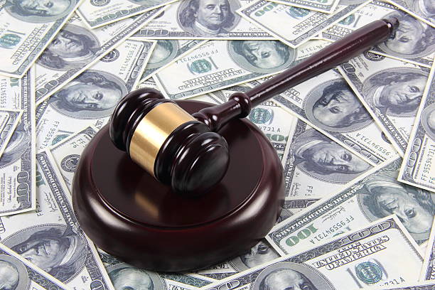 istock American money and gavel 587928362