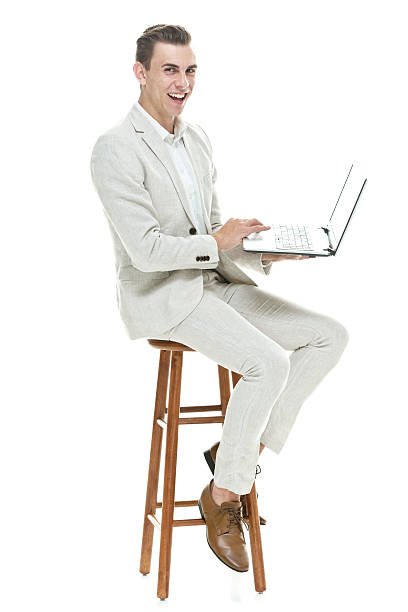 istock Cheerful businessman working on laptop 587929472
