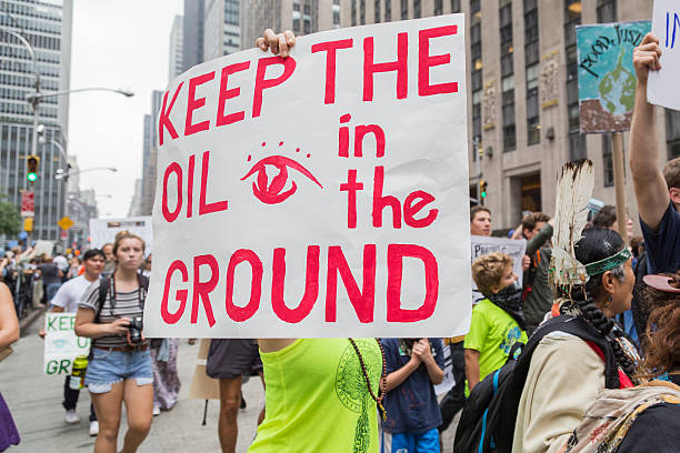 People carry placards during the People's Climate March, NYC stock photo