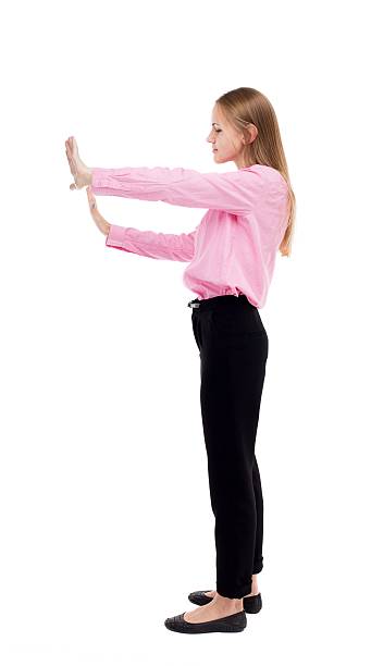istock back view of business woman pushes wall. 587930492