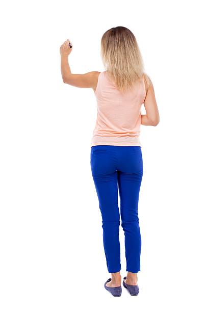 istock back view of writing beautiful woman. 587930656