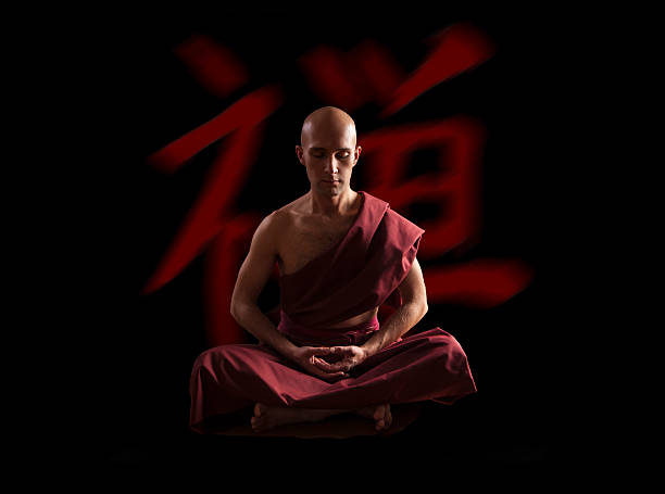 istock buddhist monk in meditation pose over black background 587932752