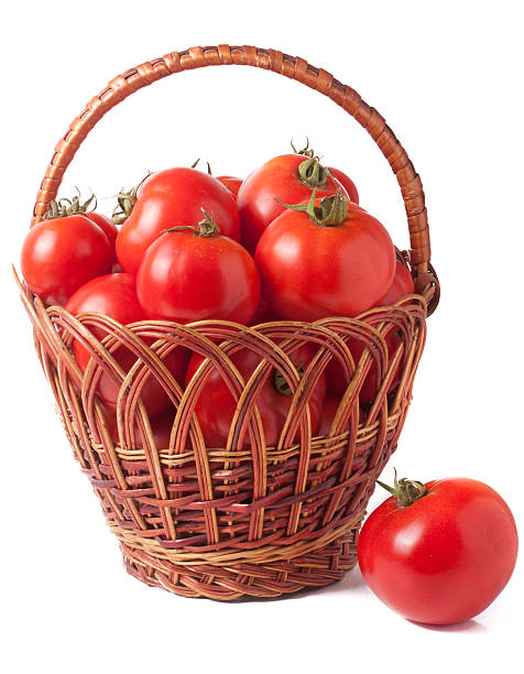istock red tomatoes in a wicker basket isolated on white background 587932840