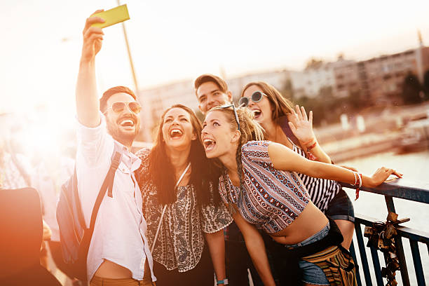 istock Friends taking selfies and smiling 587933786