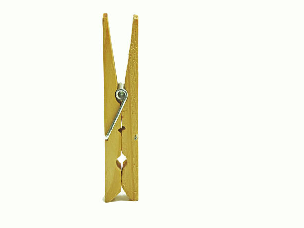 istock Wooden clothespin isolated on white. 587933824