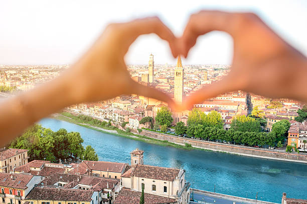 istock Heart shape on Verona cityscape background 587934430