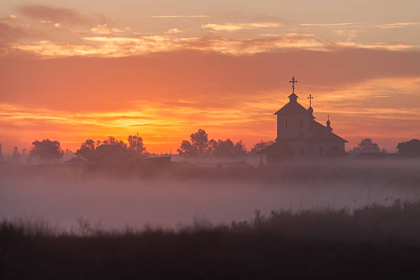 istock Beautiful sunrise over Church. 587936014