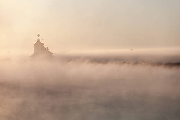 istock Beautiful sunrise over Church. 587936478