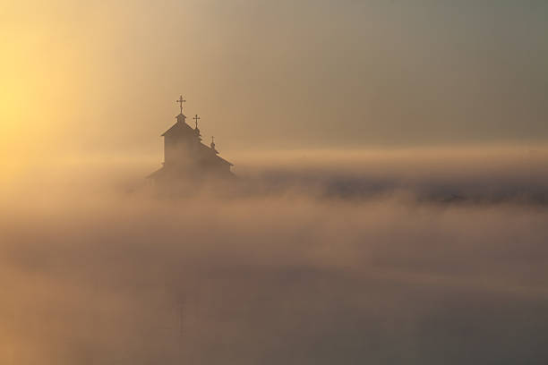istock Beautiful sunrise over Church. 587936554