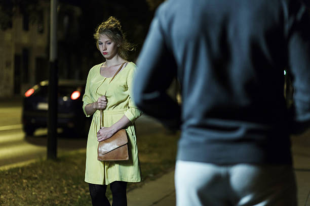 istock Lonely woman and robber 587937402