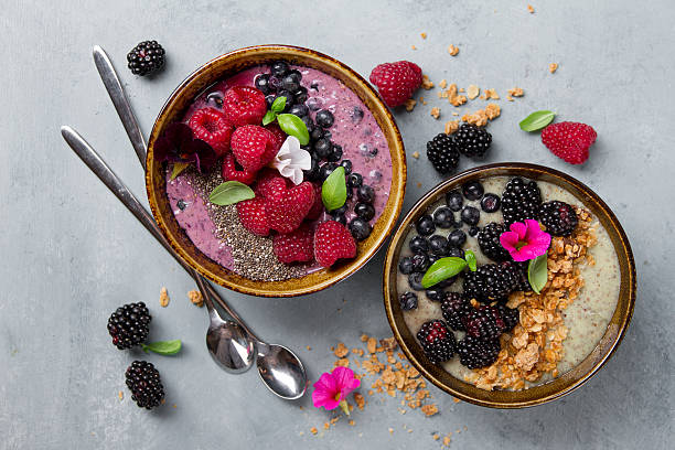 istock Breakfast berry smoothie bowl topped with berries 587937526