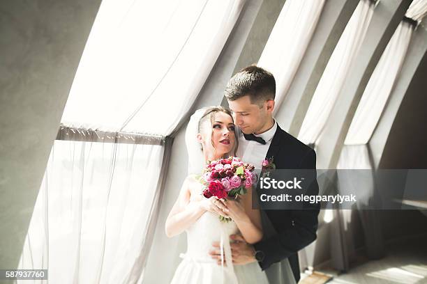 Portrait Of Happy Newly Wedding Couple With Bouquet Stock Photo - Download Image Now
