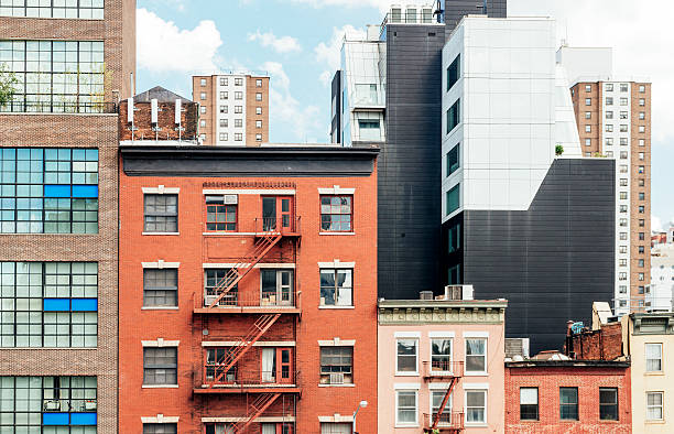 urban nyc chelsea manhattan neighborhood with multicolored residential buildings - chelsea new york imagens e fotografias de stock