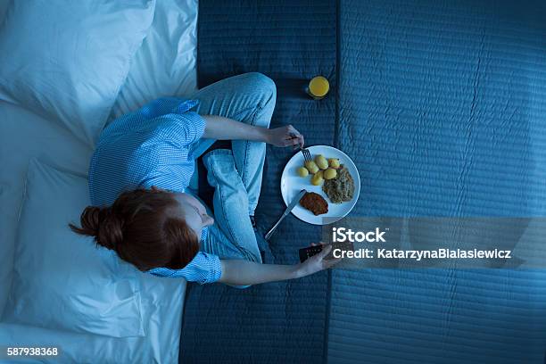 Monotony In Her Life Stock Photo - Download Image Now - Eating, Night, Bed - Furniture