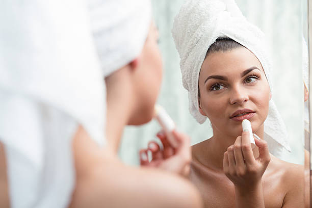 istock Taking care of her lips 587939144