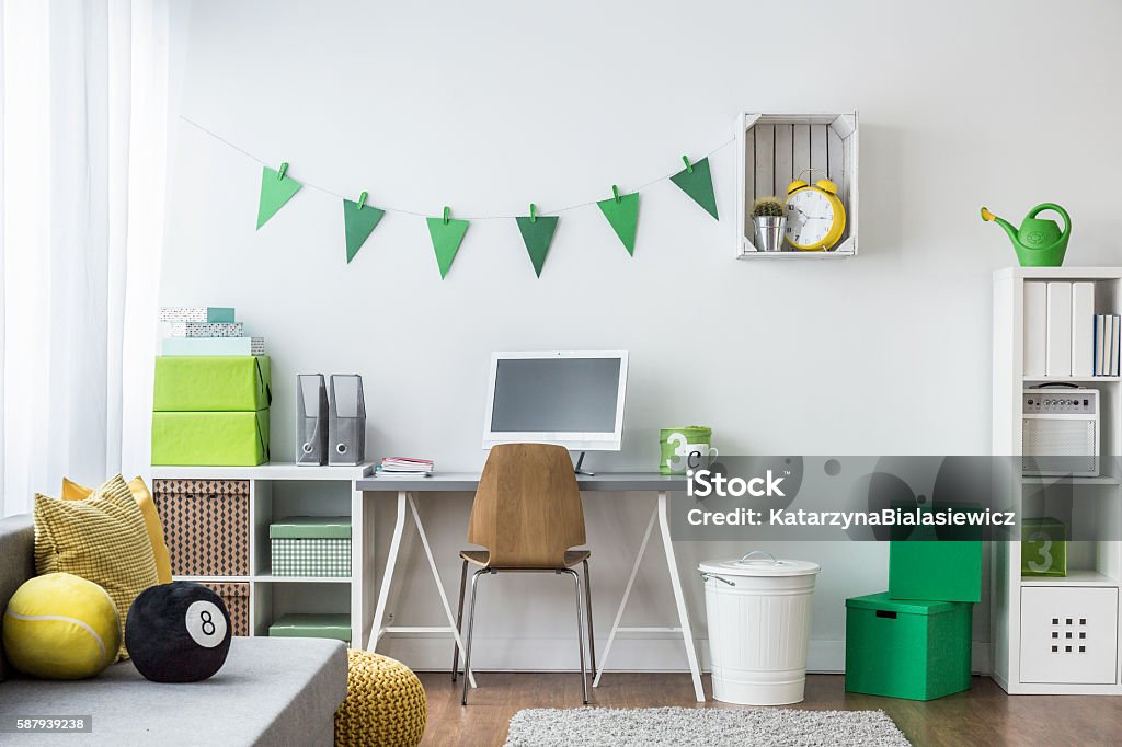 Teenager room with green decorations Spacious creating and inspiring room to work and learn Bedroom Stock Photo