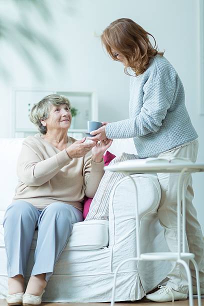 istock Helping old and ill mother 587939450