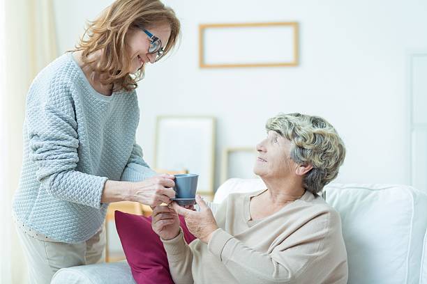 istock Taking care of old mother 587939544