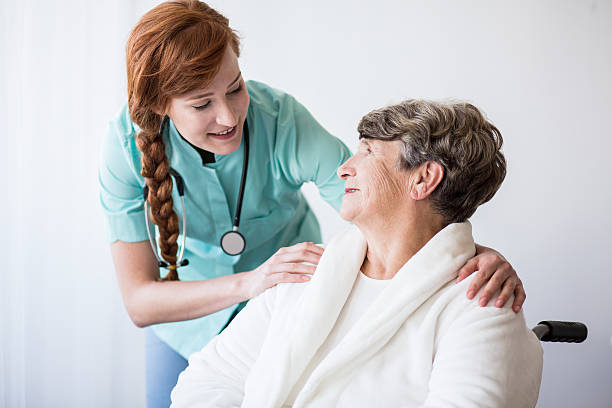 istock Doctor and elderly woman 587940452