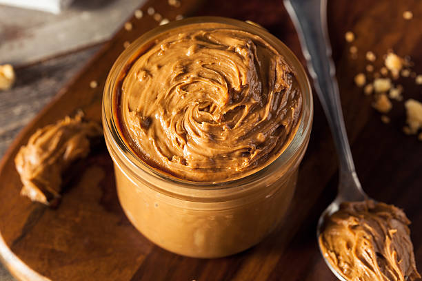 Homemade Sweet Cookie Butter Homemade Sweet Cookie Butter in a Jar crunchy stock pictures, royalty-free photos & images