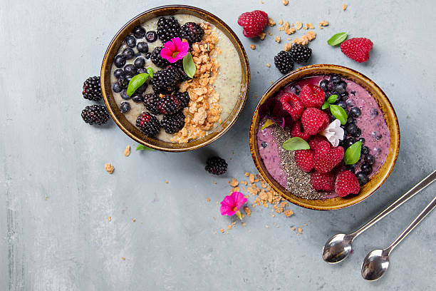 istock Breakfast berry smoothie bowl topped with berries 587941222