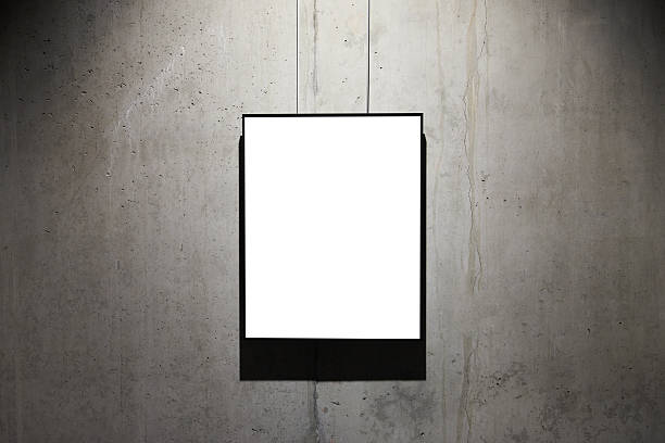 Empty black frame on concrete wall Empty black frame on concrete wall isolated on white hanging art on wall stock pictures, royalty-free photos & images