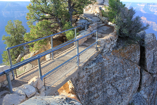 Crossing over the rocks that lead to Bright Angel Point, on the North Rim of the Grand Canyon.