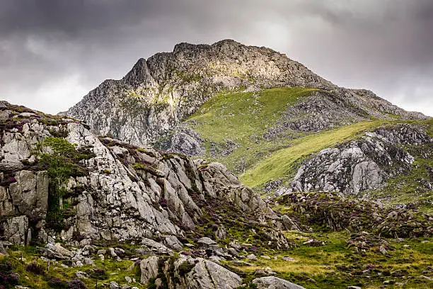 Tryfan, Moody Mountain landscape scene in North Wales, Snowdonia National Park. Ogwen, profile of giant's head in the mountain.