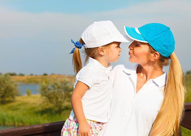 Mother and her little daughter at the golf course