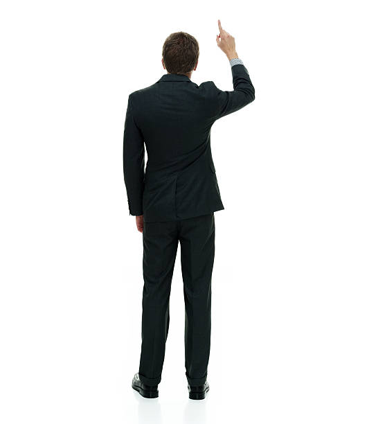istock Rear view of businessman pointing up 587949894