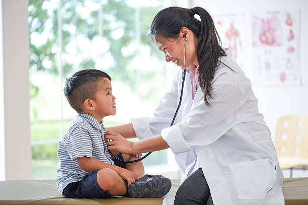 istock Cute Little Boy at the Doctors 587952462