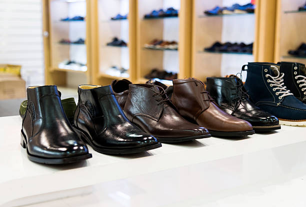 Men's shoes on sale displayed in a store.